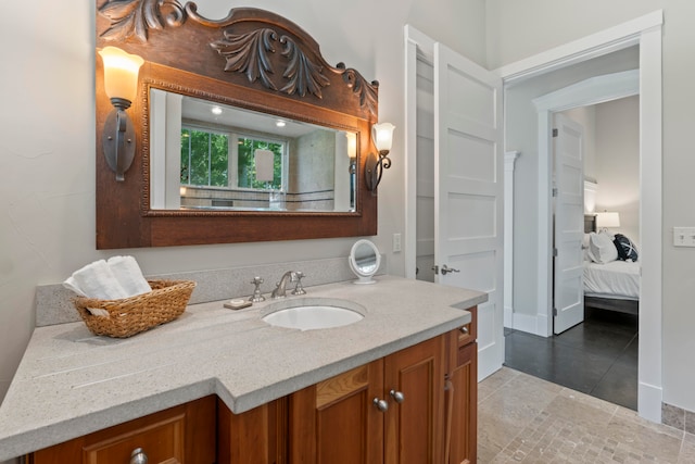 bathroom featuring tile patterned flooring and vanity