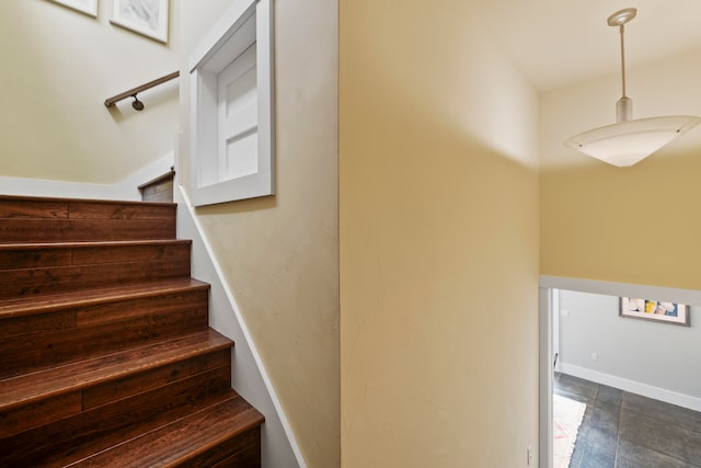 staircase featuring tile patterned floors