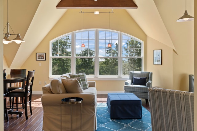 interior space with lofted ceiling with beams and a healthy amount of sunlight