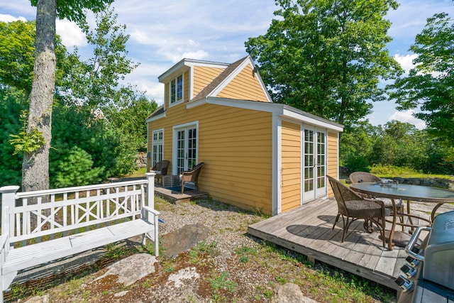 view of side of home featuring a wooden deck