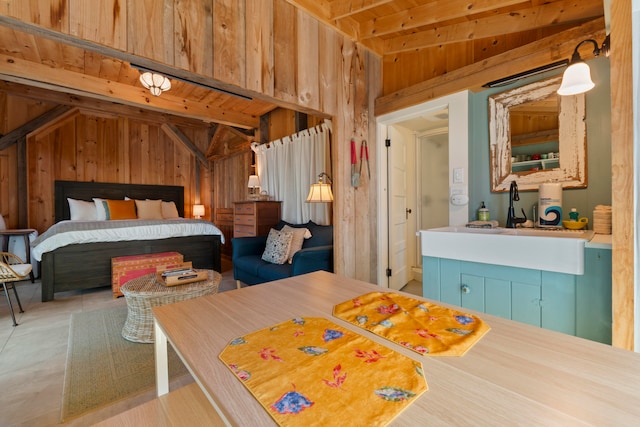 bedroom with wood ceiling, wood walls, sink, and lofted ceiling with beams