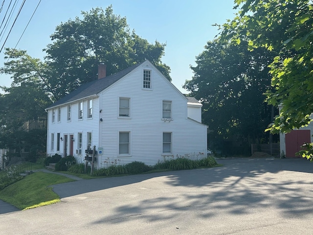 view of home's exterior featuring a chimney