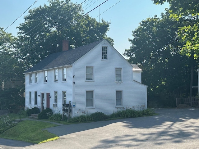 view of home's exterior featuring a chimney