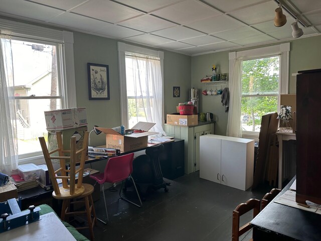 home office with a paneled ceiling