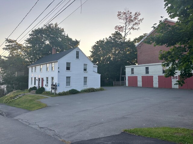 view of property exterior at dusk