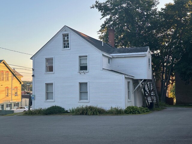 view of property exterior at dusk