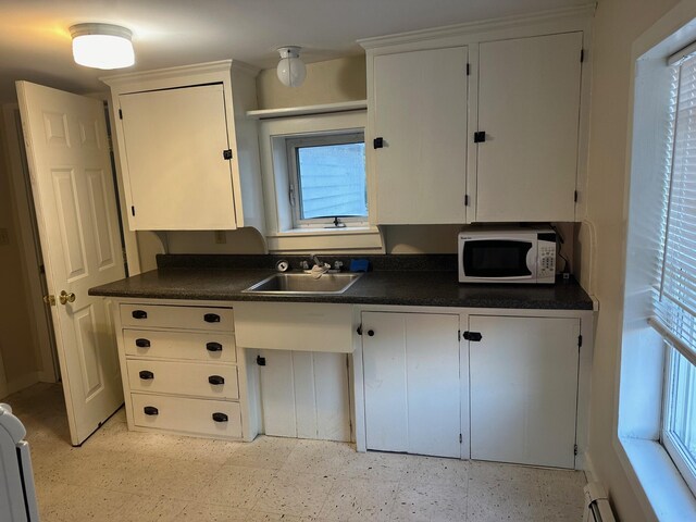 kitchen with sink and white cabinets