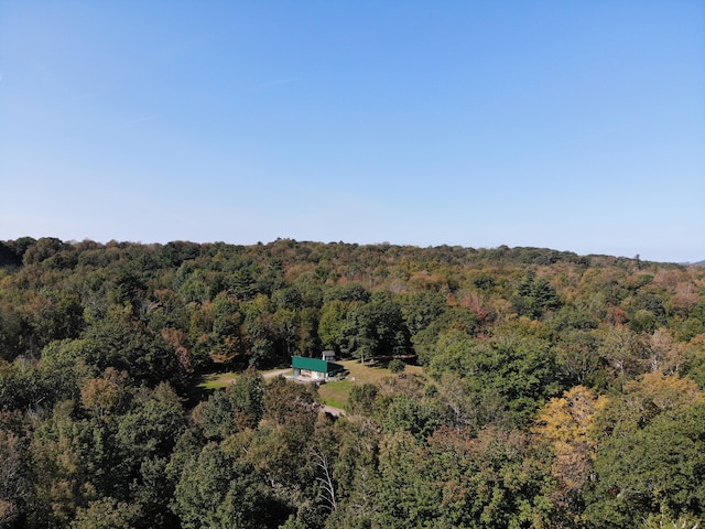 243 Lang Hill Hwy, Brooks, ME 04921 - aerial view of property and surrounding area with a heavily wooded area