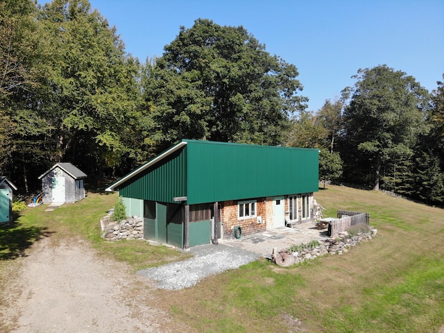 243 Lang Hill Hwy, Brooks, ME 04921 - view of front of house with a front lawn, driveway, and a patio
