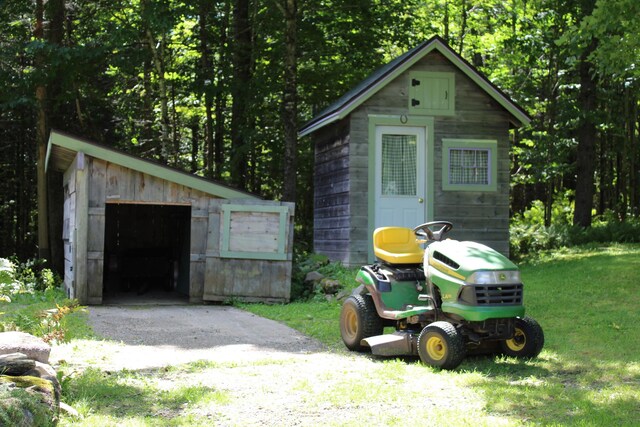 243 Lang Hill Hwy, Brooks, ME 04921 - view of outbuilding with asphalt driveway