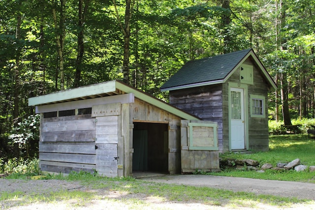 243 Lang Hill Hwy, Brooks, ME 04921 - view of outdoor structure with a wooded view