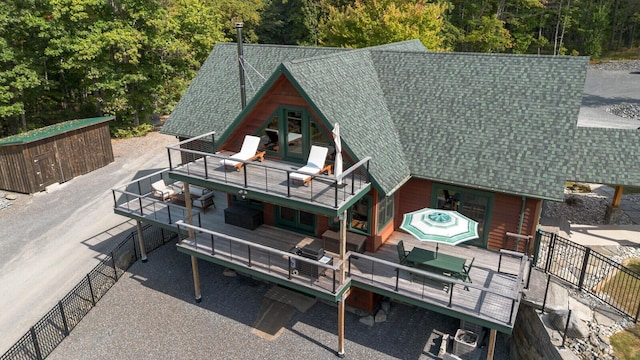 birds eye view of property with a wooded view
