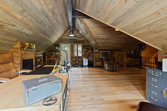 bonus room featuring wood ceiling, lofted ceiling, wooden walls, light wood-type flooring, and a fireplace