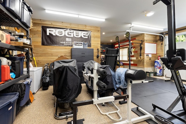 exercise room with wood walls