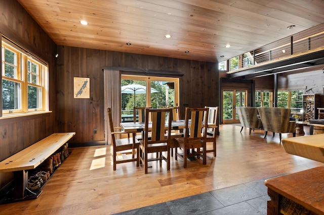 dining area featuring recessed lighting, wooden walls, and wood ceiling