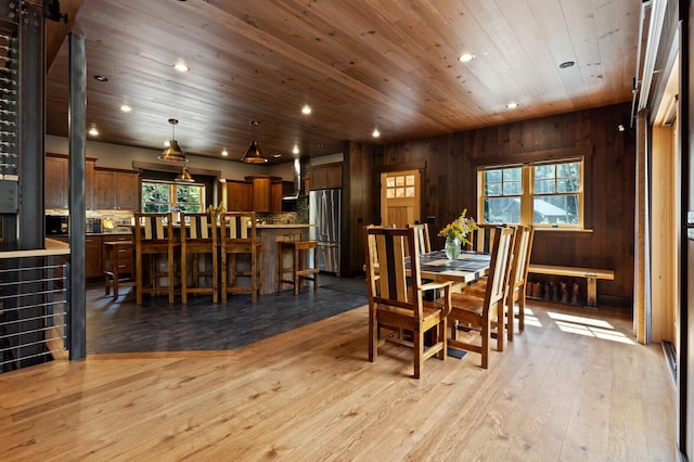 dining space with recessed lighting, wood finished floors, a healthy amount of sunlight, and wooden ceiling