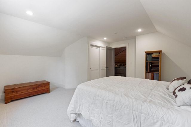 bedroom with recessed lighting, carpet floors, a closet, and lofted ceiling