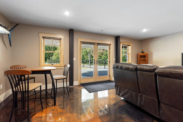 living area with french doors, recessed lighting, and baseboards