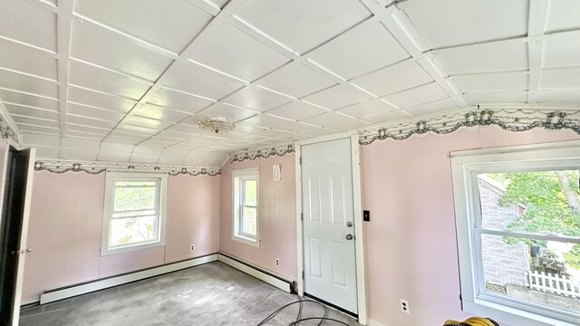 entrance foyer featuring a baseboard radiator and concrete floors