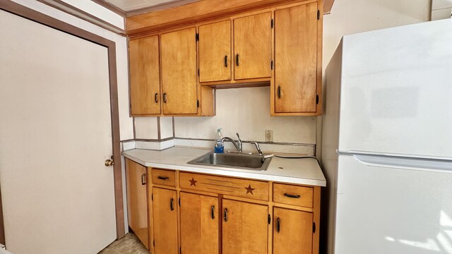 kitchen with white refrigerator and sink