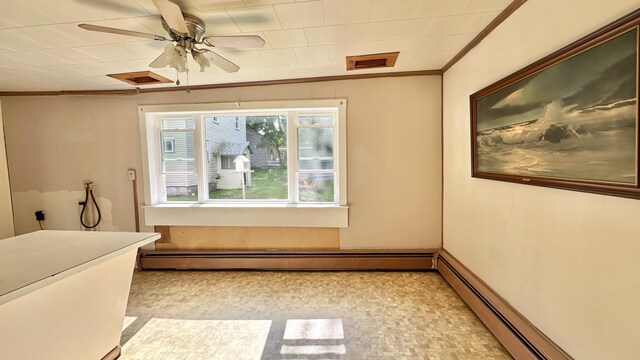 bathroom featuring ceiling fan, baseboard heating, and ornamental molding