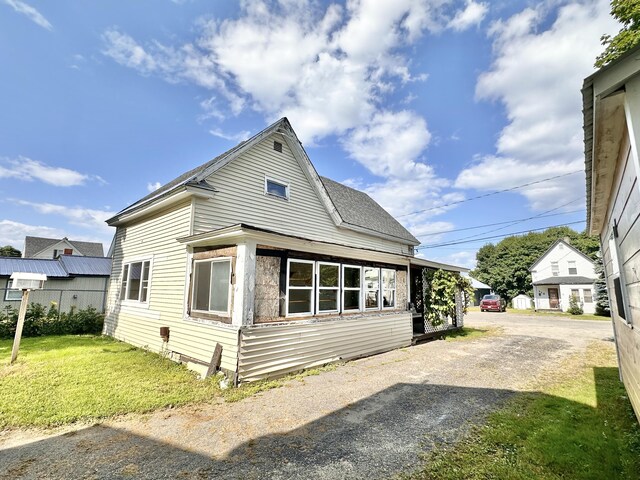 view of home's exterior with a lawn