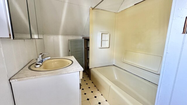 bathroom featuring vanity and shower / bath combination