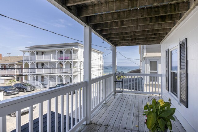 wooden deck featuring a water view