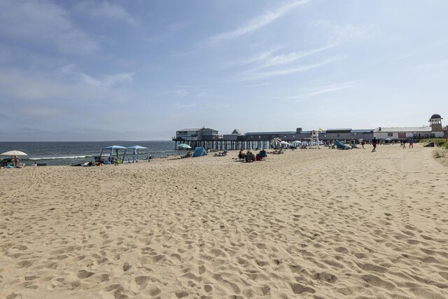 property view of water featuring a beach view