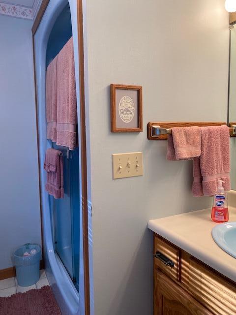 bathroom with vanity and tile patterned floors