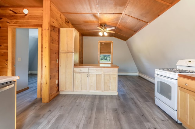 kitchen with white range with gas cooktop, stainless steel dishwasher, lofted ceiling, light brown cabinets, and ceiling fan