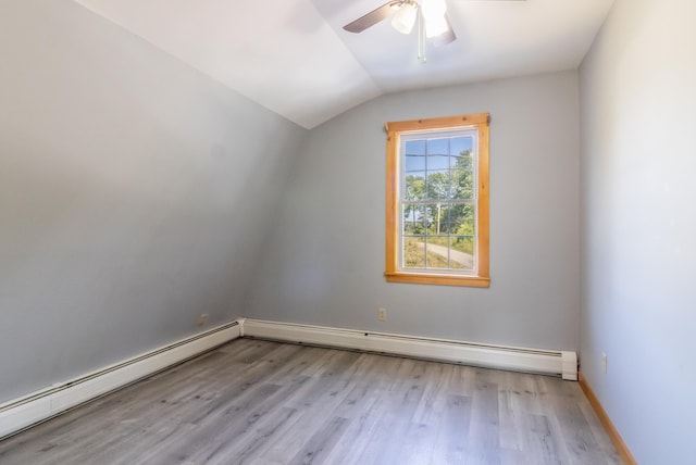 bonus room with a baseboard radiator, lofted ceiling, light wood finished floors, and ceiling fan