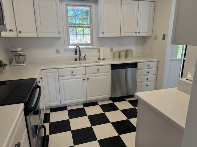 kitchen with white cabinetry, sink, and appliances with stainless steel finishes