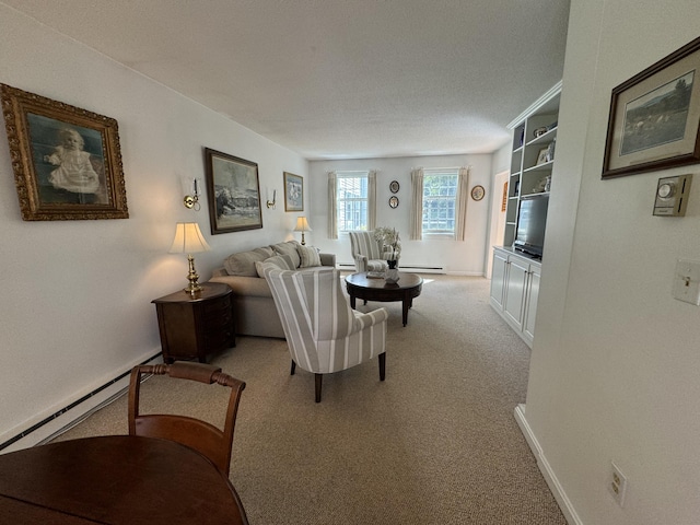 living room with carpet and a baseboard heating unit