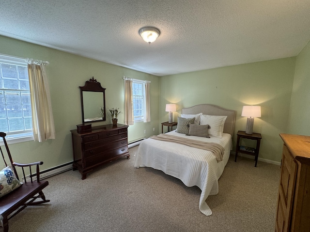 bedroom with a baseboard radiator, light colored carpet, and a textured ceiling