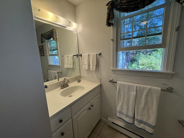 bathroom with vanity, tile patterned flooring, and baseboard heating