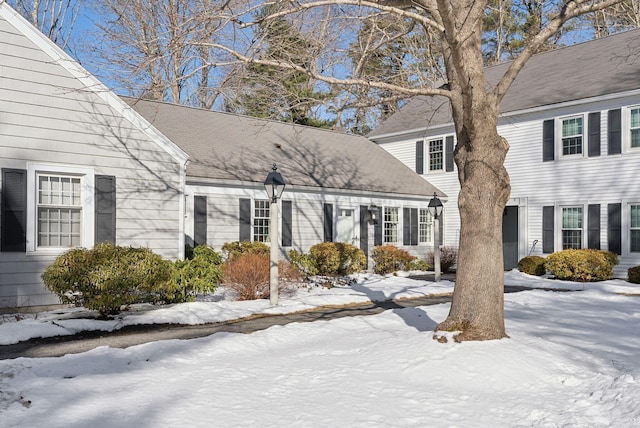 view of snow covered property entrance