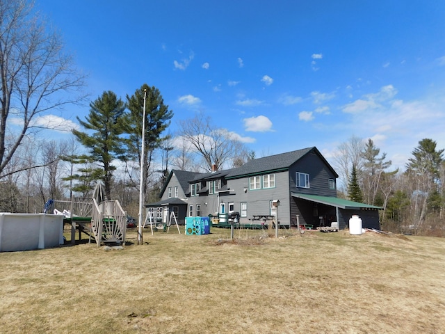 exterior space with an outdoor structure and a playground