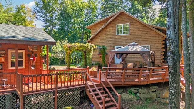 wooden terrace featuring a gazebo