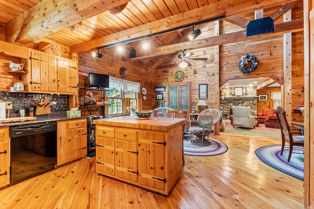 kitchen with wood walls, dishwasher, beam ceiling, light hardwood / wood-style floors, and ceiling fan