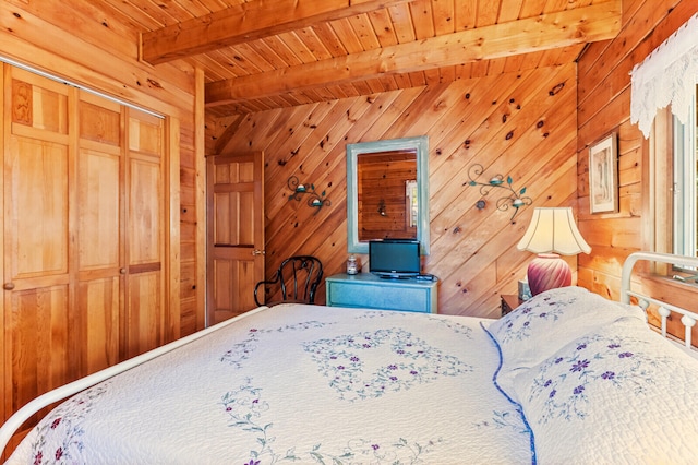 bedroom featuring wood ceiling, a closet, wooden walls, and beam ceiling