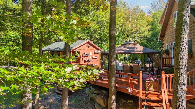 exterior space featuring a deck and a gazebo