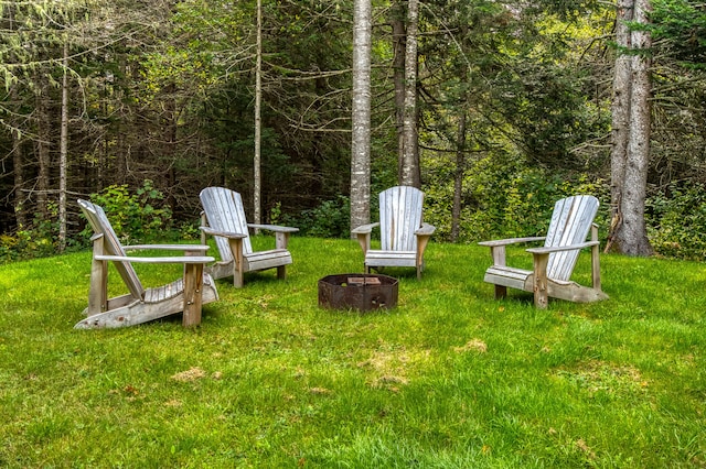 view of yard with an outdoor fire pit