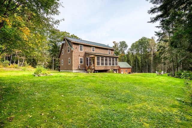 rear view of house with a lawn