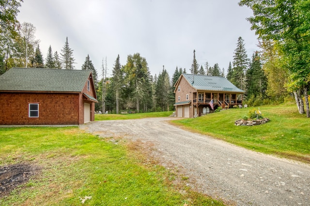 exterior space featuring a front yard and a garage