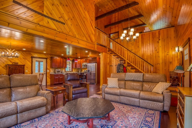 living room with wooden ceiling, wood-type flooring, a high ceiling, and wood walls