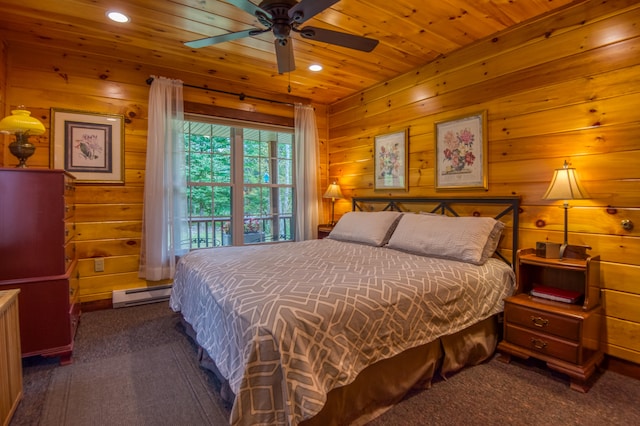 carpeted bedroom with a baseboard heating unit, wooden walls, ceiling fan, and wooden ceiling