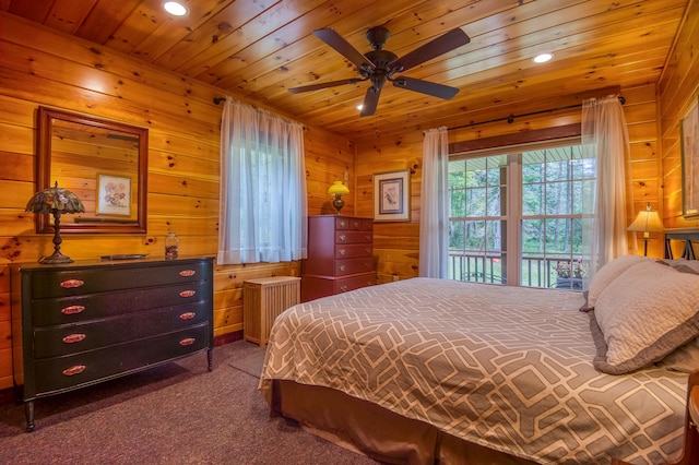 bedroom featuring radiator, ceiling fan, wooden ceiling, and wooden walls