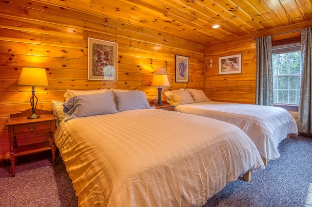 carpeted bedroom featuring wooden ceiling and wood walls