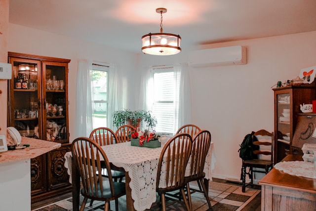 dining space with a wall mounted air conditioner